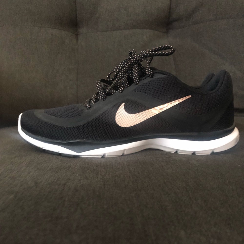 Rose gold and black Nike shoes